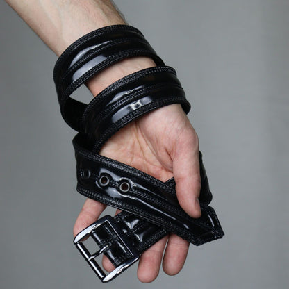 Gun Metal Belt – glossy black PVC multi-strap design with metal hardware, stacked detail view