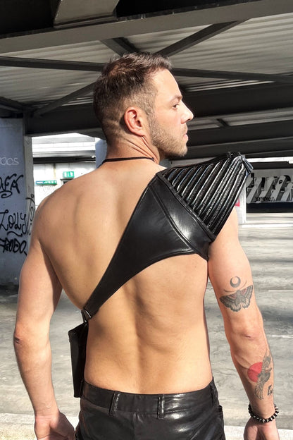 Humero Top – black glossy patent leather holster harness with vertical ribbed detailing, back view