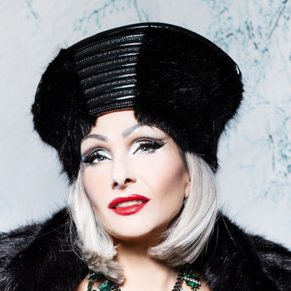 Zar Hat – black faux fur with glossy leather band and studded metallic details, profile