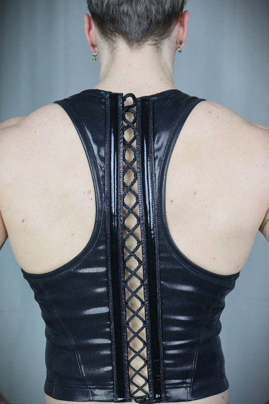 Serratus Top – glossy black leatherette sleeveless top with side-panel lacing, back view
