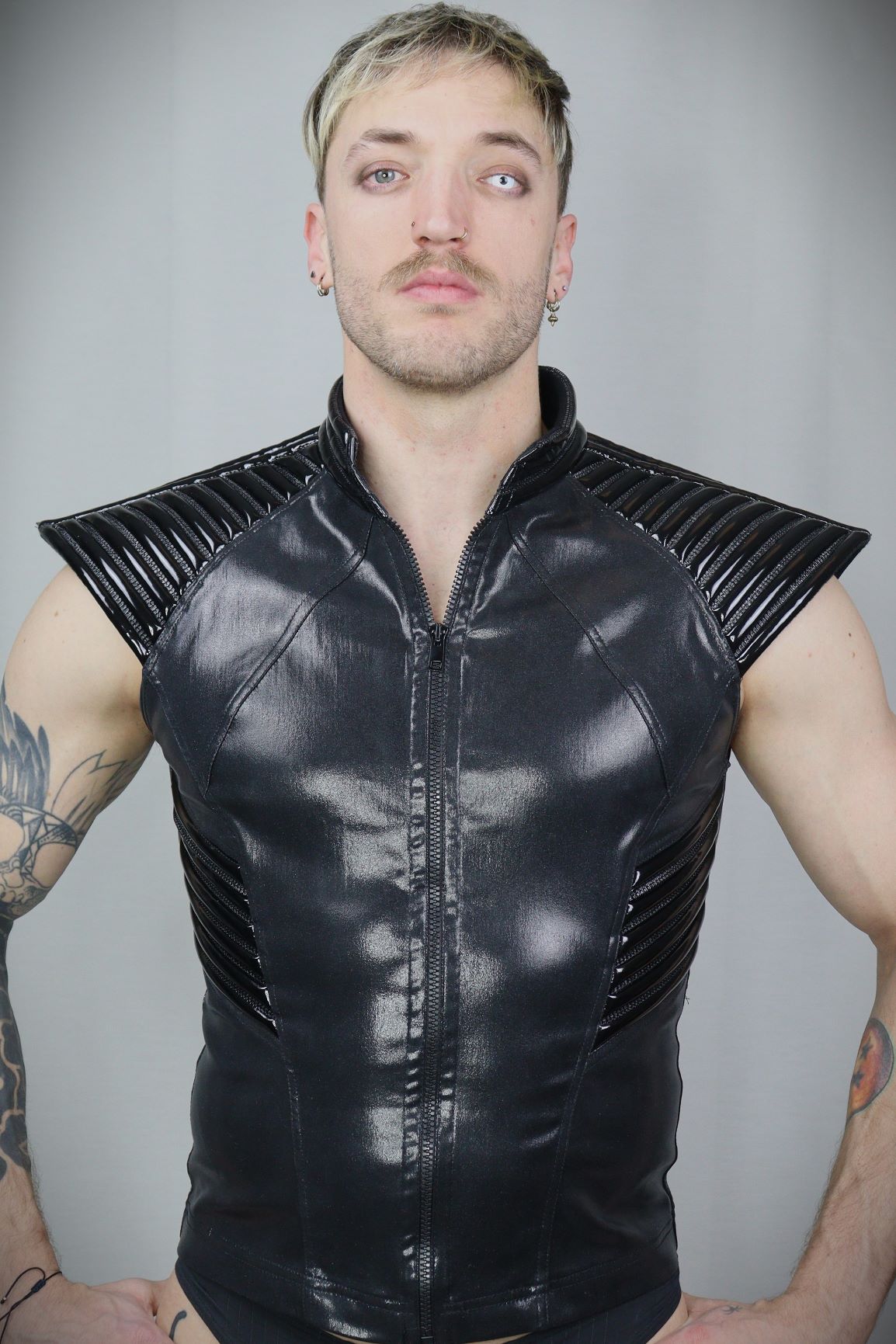 Thorax Top – glossy black leatherette sleeveless top with ribbed shoulder panels, front view