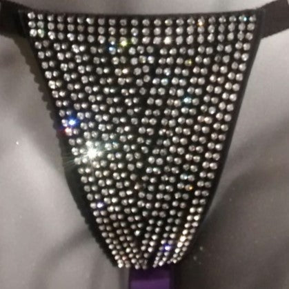 Venus String – black studded thong with rhinestone triangular front, top-down view