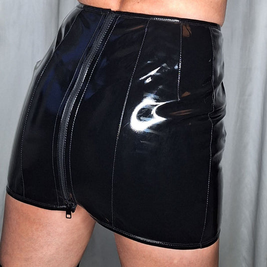 Zar Skirt – glossy black patent mini dress with side zipper and seam detailing, side view