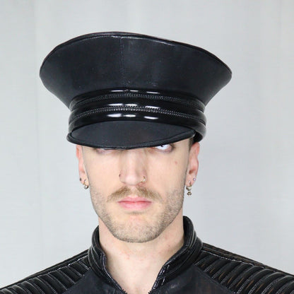 Cap in Leatherette - glossy black military-style cap with patent banding detail, front view