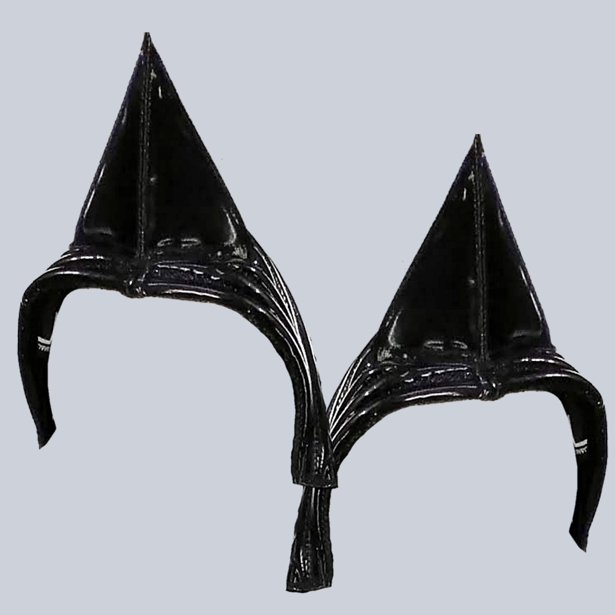 Horn DK – glossy black sculptural horn extensions with layered silhouette, close-up