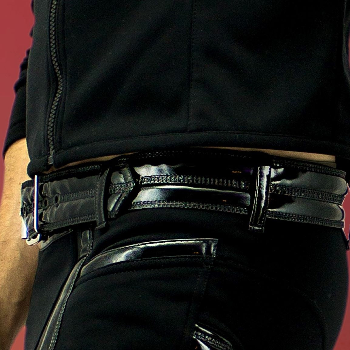 Belt – glossy black patent leather with silver buckle, detail view