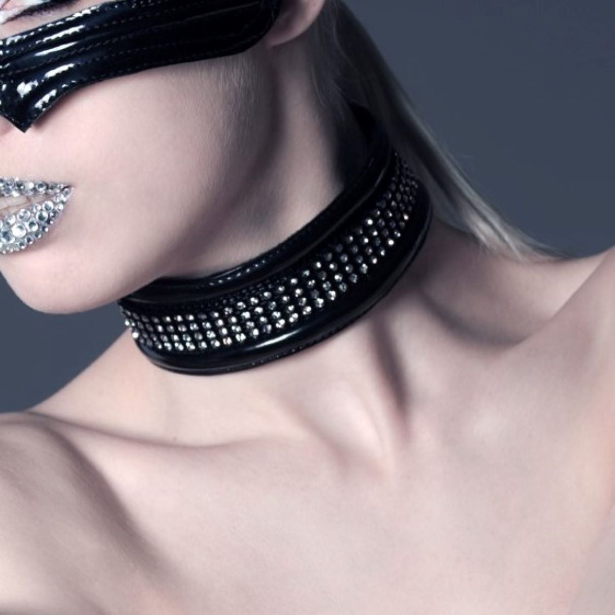 Blink – black patent leather choker with rhinestone stud embellishment, close-up neckline view