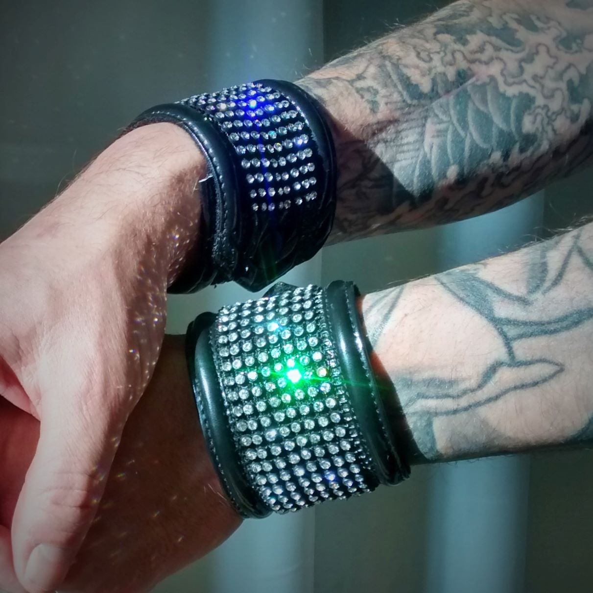 Blixx Big - glossy black with rhinestone studded grid and LED center, close-up