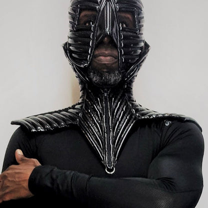 Collar – black PVC collar with strapped ribbed patterns and metal chains, detail view