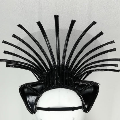 Comtesse DK – sculptural headpiece with fanned spiky tendrils, overhead view on display