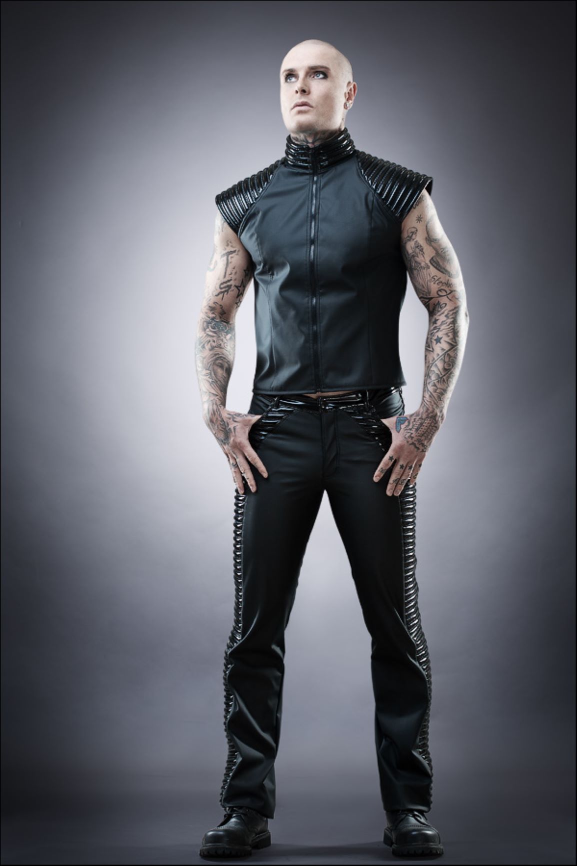 Jeans – black leatherette pants with corset lacing and glossy ribbed vest, front view