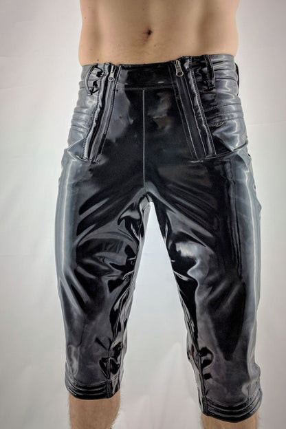 Knigger – glossy black PVC capri pants with striped side panels, front view