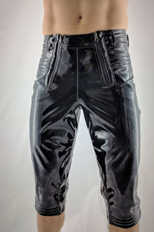 Knigger – glossy black PVC capri pants with striped side panels, front view