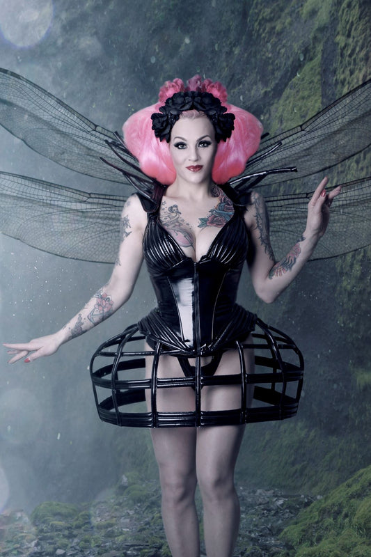 Rococo Mini Skirt – black patent cage mini skirt with glossy finish, front view