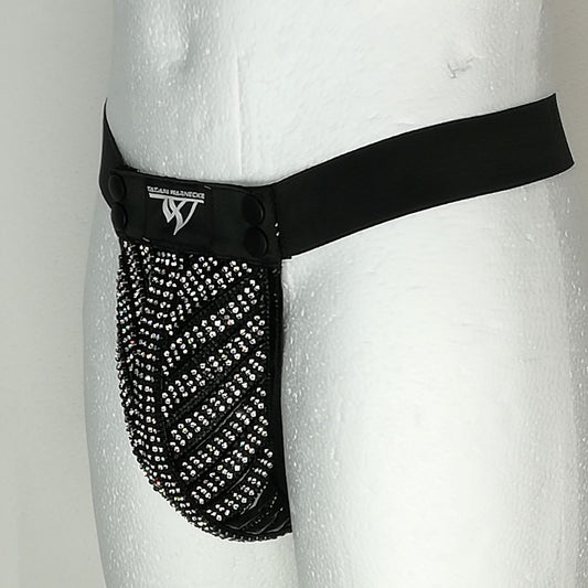 Trigo String with Rhinestones – black fabric with densely studded rhinestone pattern, close-up