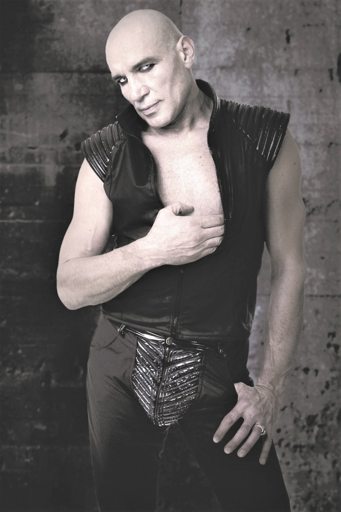 Trigo Pant – glossy black PVC pants with ribbed vertical panels, front view