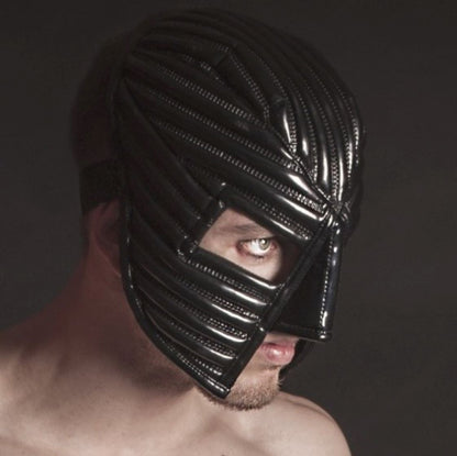 Warrior Mask – glossy black PVC with radiating ribs and open eye window, side view