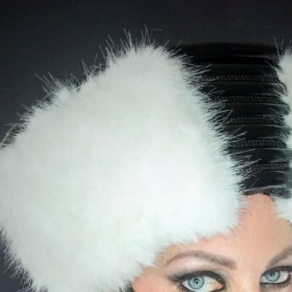 Zar Hat – white faux fur with black leather accents and metallic striping, close-up