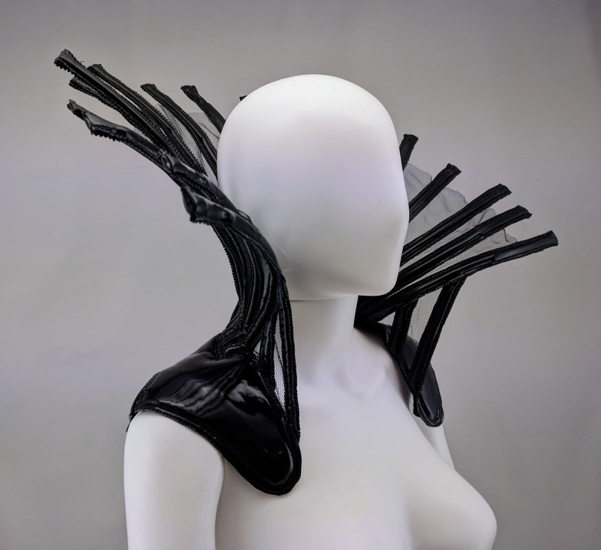 Comtesse DK – glossy black latex ensemble with sculptural headpiece on dress form, detail