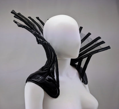 Comtesse DK – glossy black latex ensemble with sculptural headpiece on dress form, detail